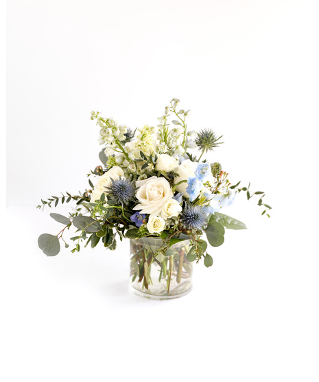  the Freedom arrangement - a timeless portrayal of tranquility and freedom. Allow yourself to embrace the classic beauty of blue and white with this flower arrangement. 