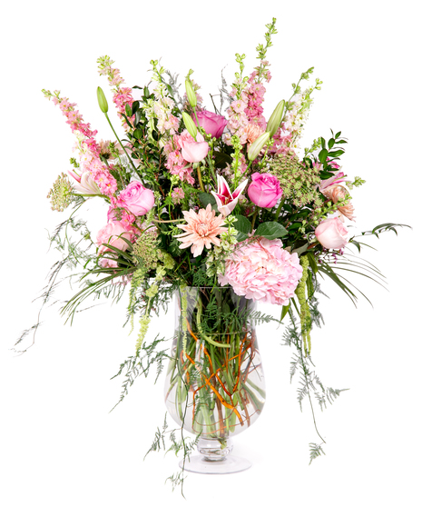 Overflowing Love features a variety of pink roses, hydrangeas, and stargazer lilies adorned with touches of greenery and foliage