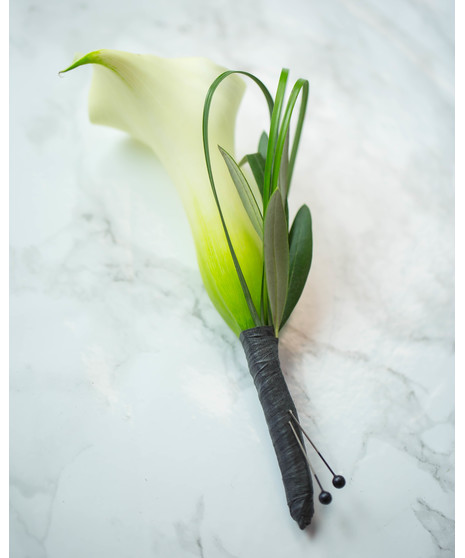 Perfect for Prom or Homecoming! This traditional boutonniere of italian ruscus, and an elegant white rose is the perfect accessory to your special day.