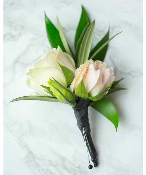 Perfect for Prom or Homecoming! This traditional boutonniere of italian ruscus, and an elegant white rose is the perfect accessory to your special day.