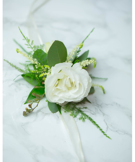 Perfect for Prom or Homecoming! This traditional boutonniere of italian ruscus, and an elegant white rose is the perfect accessory to your special day.