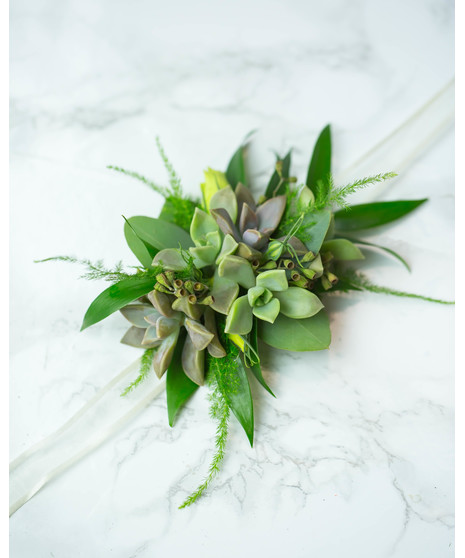 Perfect for Prom or Homecoming! This traditional boutonniere of italian ruscus, and an elegant white rose is the perfect accessory to your special day.