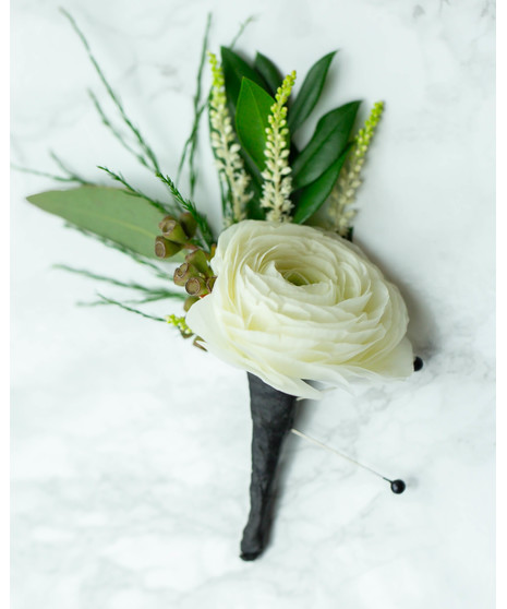 Perfect for Prom or Homecoming! This traditional boutonniere of italian ruscus, and an elegant white rose is the perfect accessory to your special day.